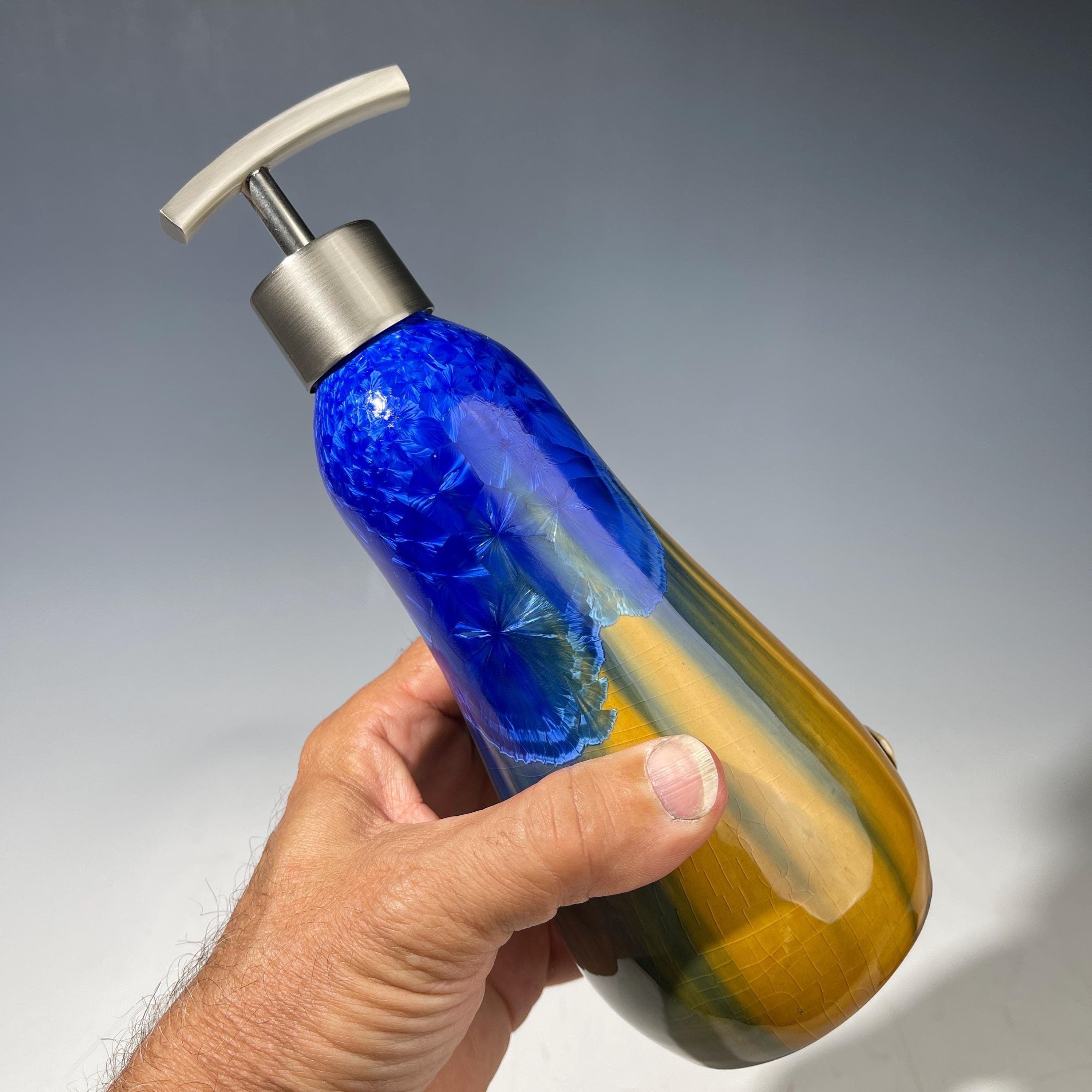 A refractive orange dreams of blue soap pump soap or lotion dispenser