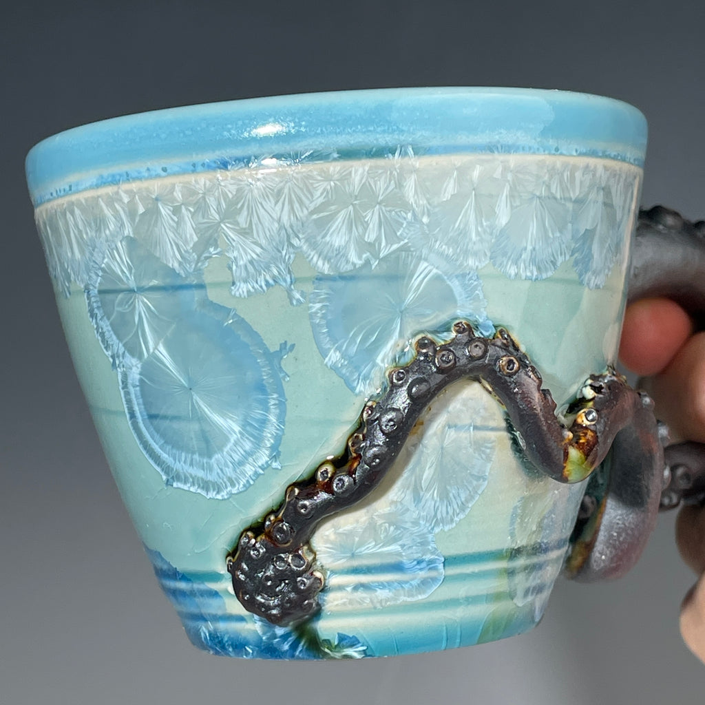 sky blue crystalline glazed cup with octopus tentacle handle by Adam & Hong Rubinstein