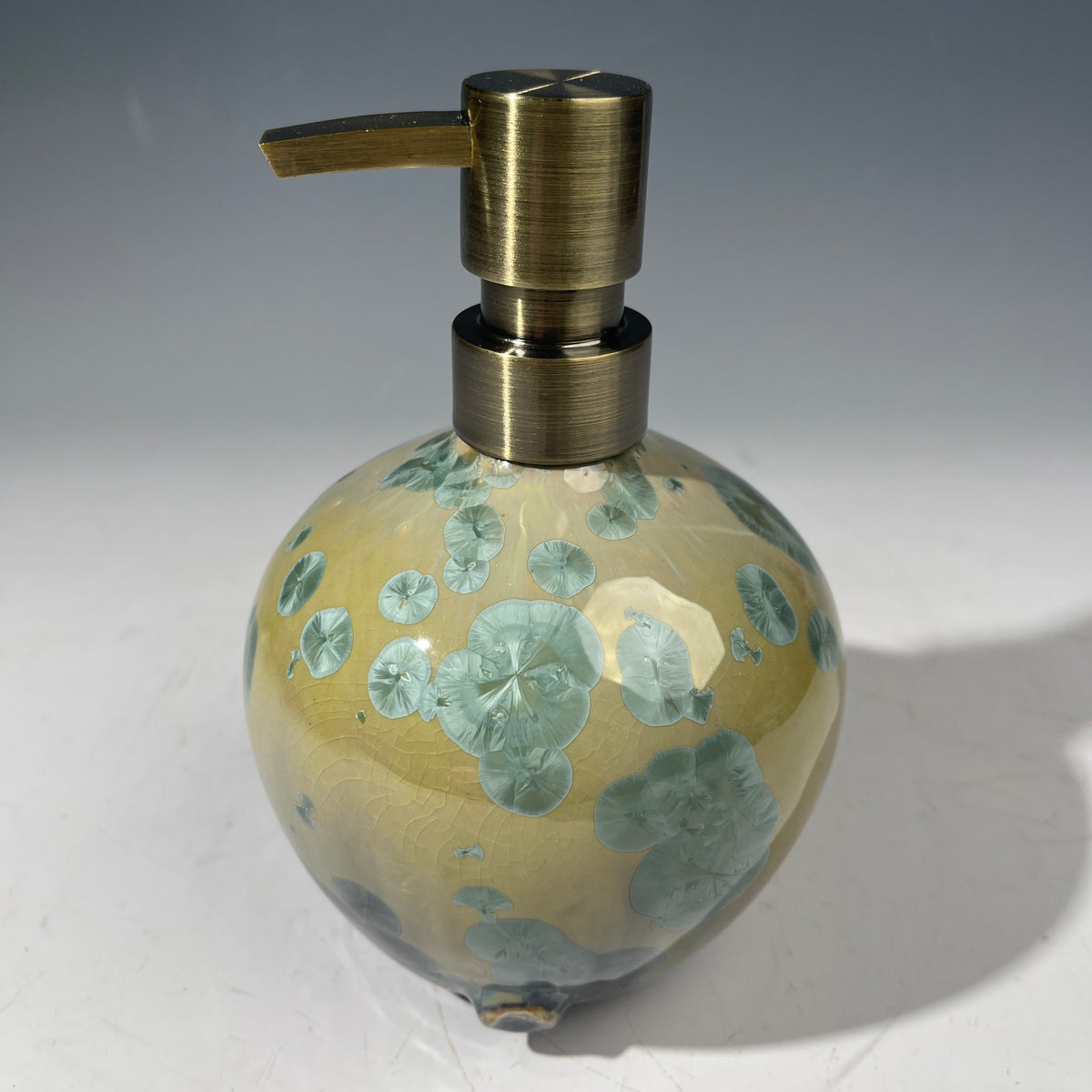 handmade soap dispenser with amazing crystalline formations in the glaze in green hues