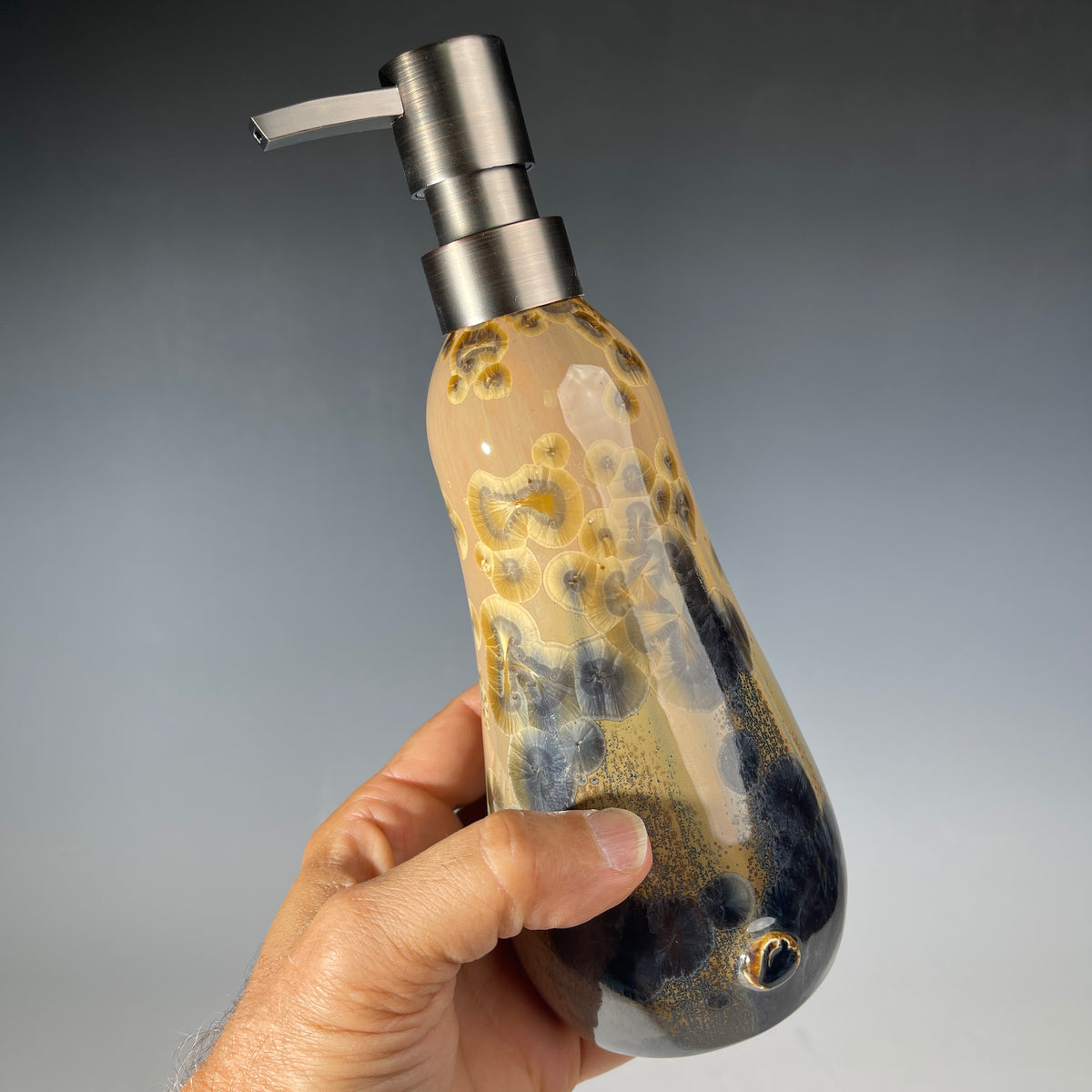 gold to charcoal soap pump is sparkling crystalline glaze