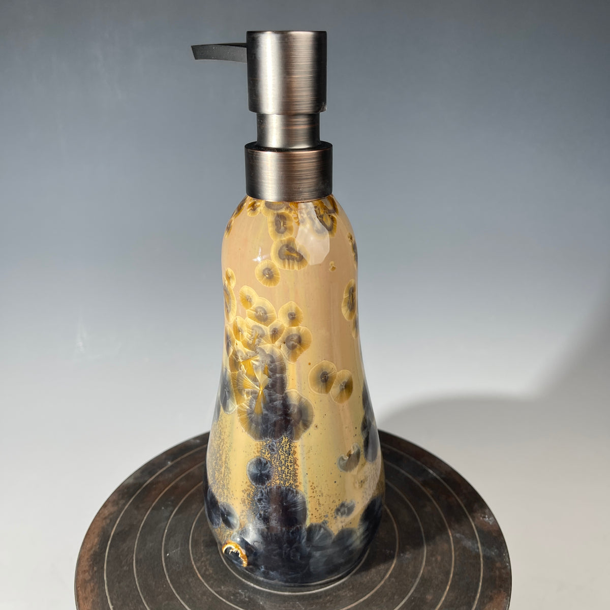 gold to charcoal soap pump is sparkling crystalline glaze