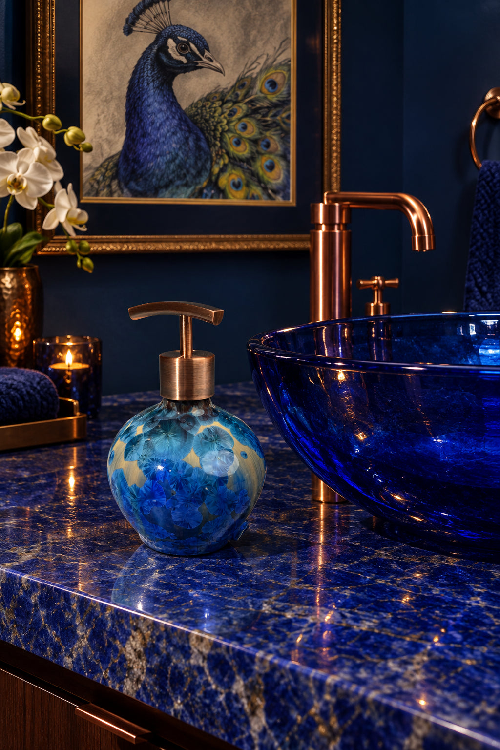 A decorative handmade ceramic functional soap dispenser bottle with a glossy blue and gold crystalline pattern, featuring a copper-finished pump dispenser