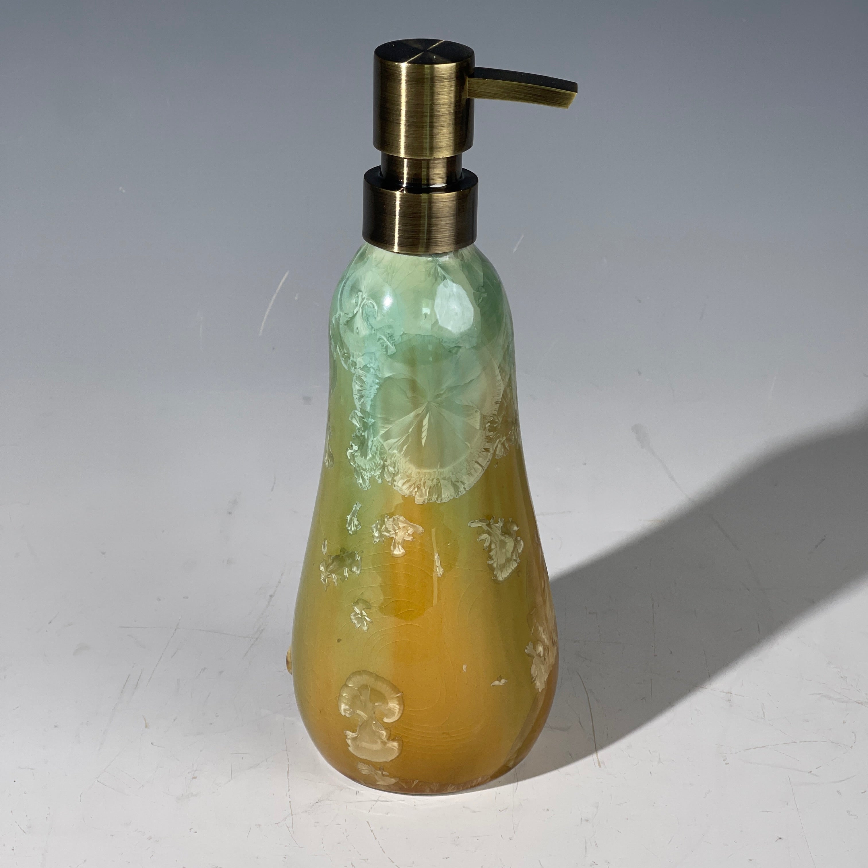 artistic soap dispenser in aqua fade to golden sunrise toned crystalline glaze