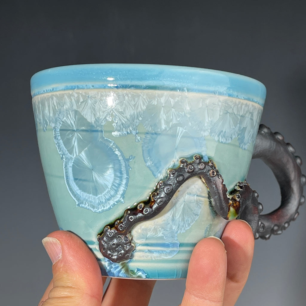 sky blue crystalline glazed cup with octopus tentacle handle by Adam & Hong Rubinstein