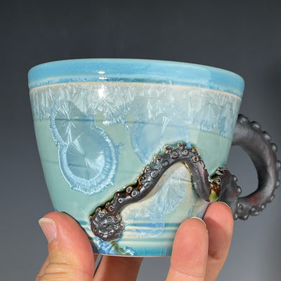 sky blue crystalline glazed cup with octopus tentacle handle by Adam & Hong Rubinstein