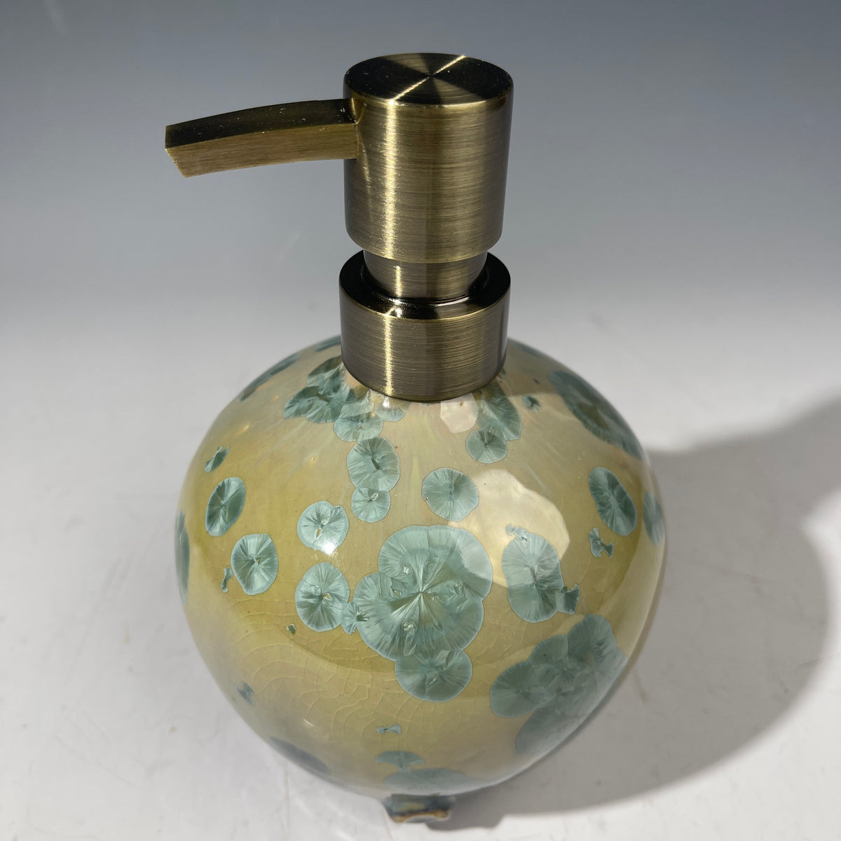 handmade soap dispenser with amazing crystalline formations in the glaze in green hues