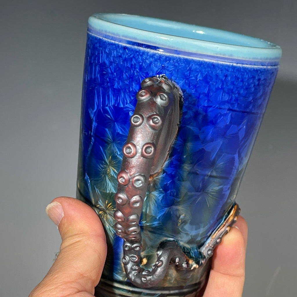 Octopus tentacle mug in cobalt macro crystalline glaze by Adam & Hong Rubinstein 
