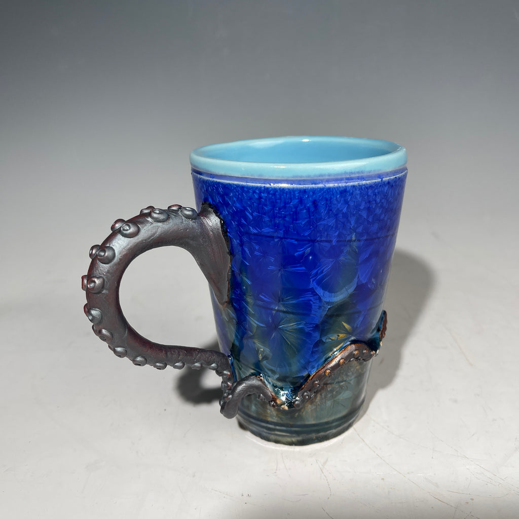 Octopus tentacle mug in cobalt macro crystalline glaze by Adam & Hong Rubinstein 
