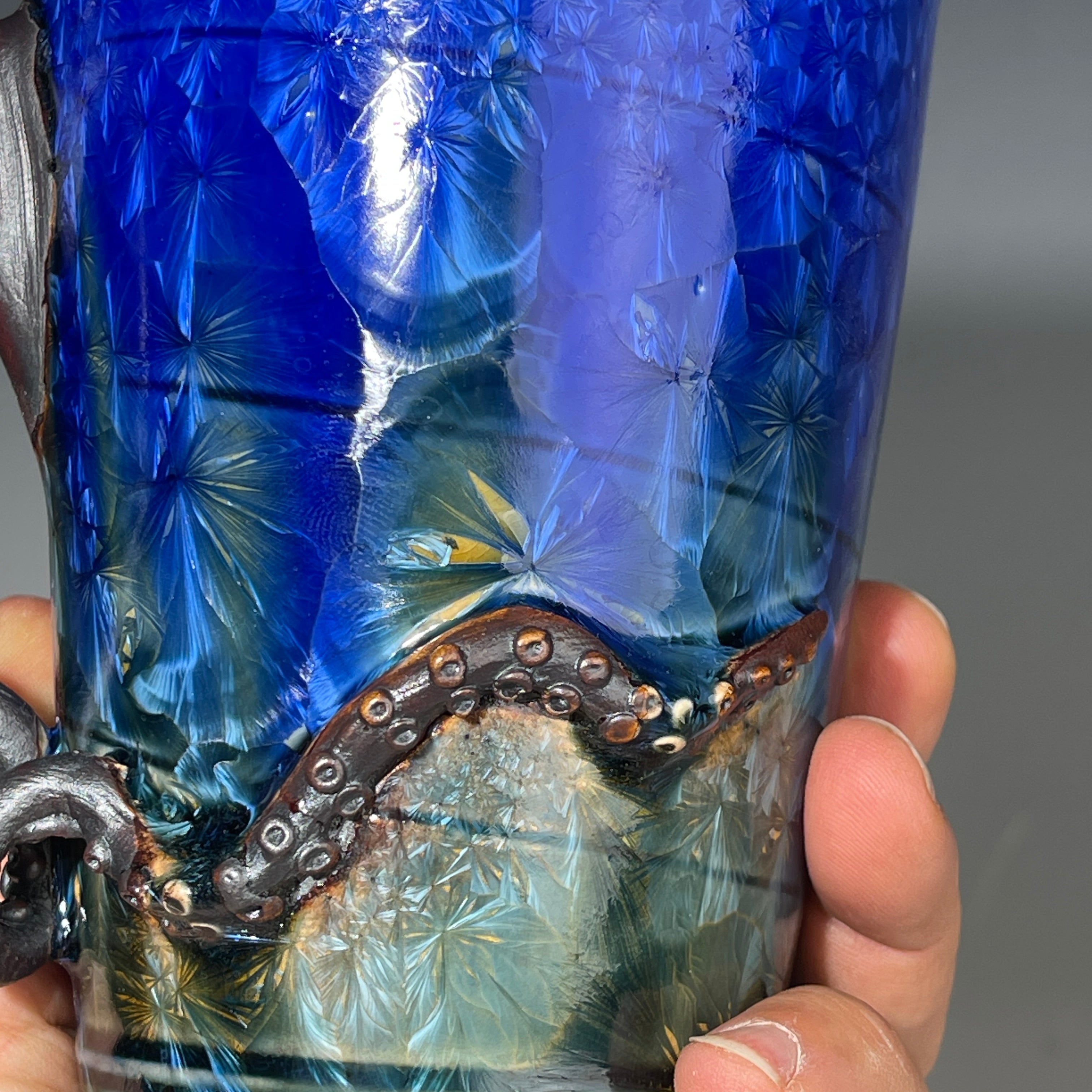 Octopus tentacle mug in cobalt macro crystalline glaze by Adam & Hong Rubinstein 