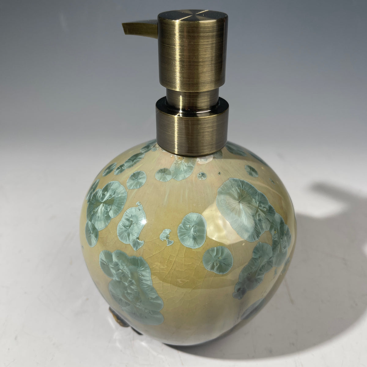 handmade soap dispenser with amazing crystalline formations in the glaze in green hues