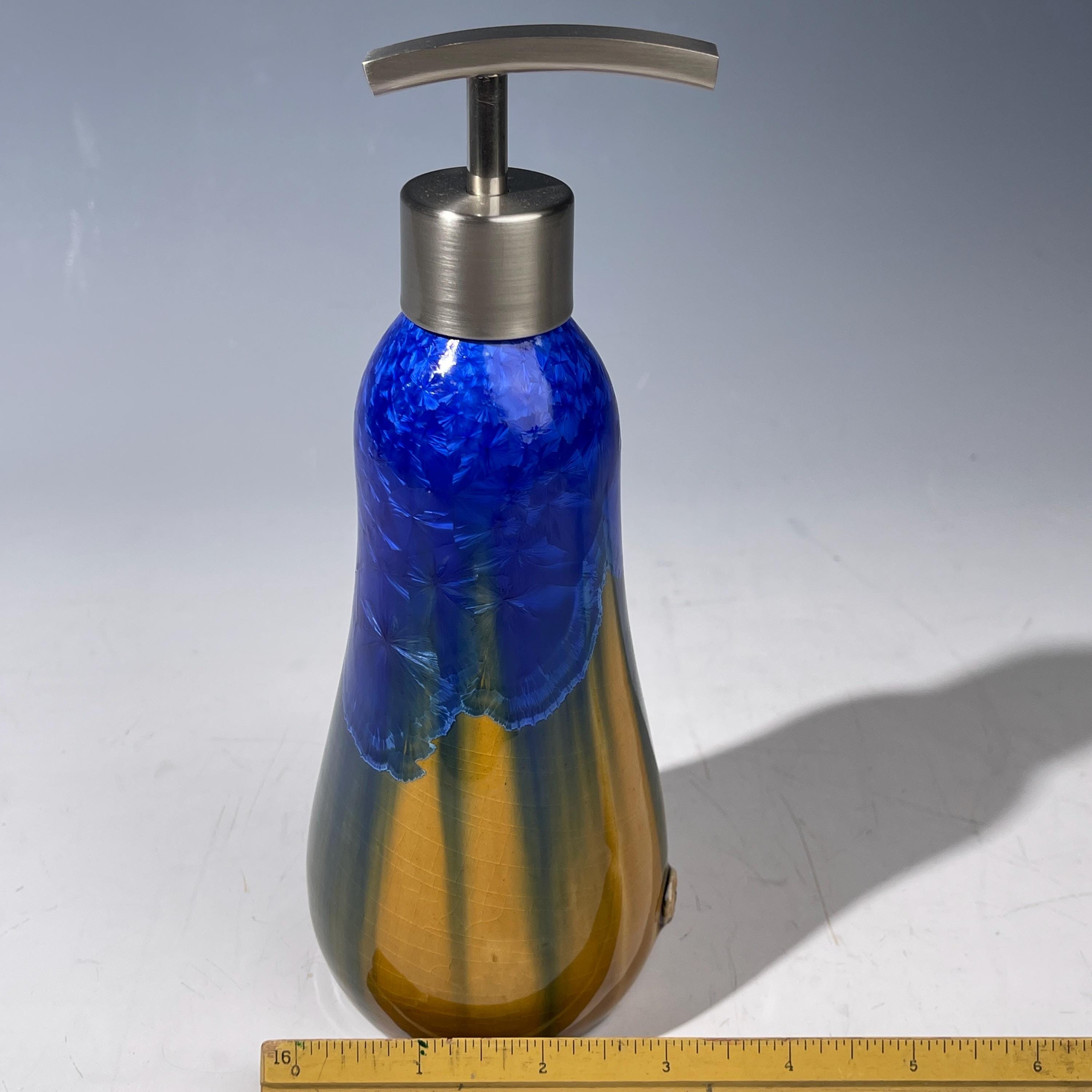 A refractive orange dreams of blue soap pump soap or lotion dispenser