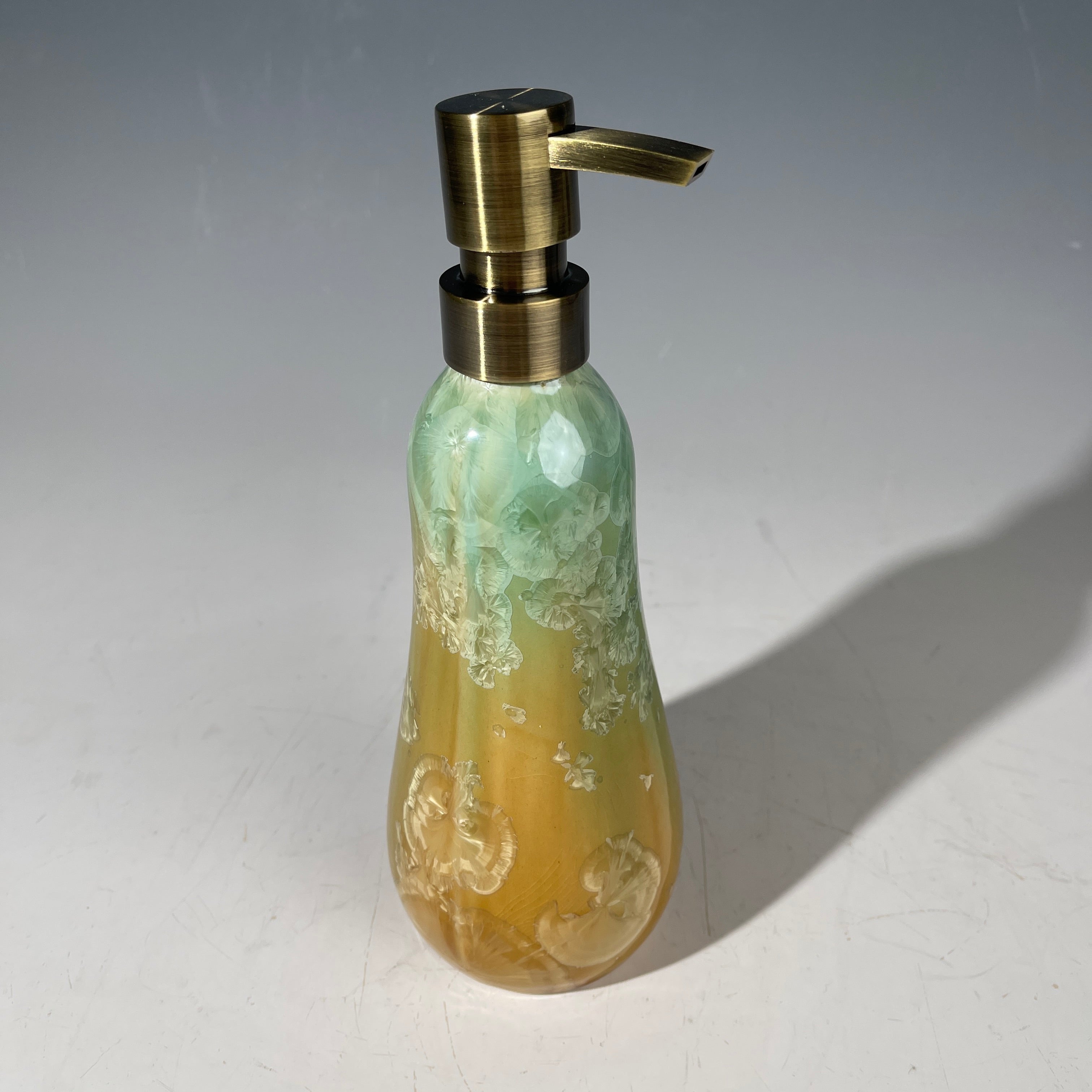 artistic soap dispenser in aqua fade to golden sunrise toned crystalline glaze