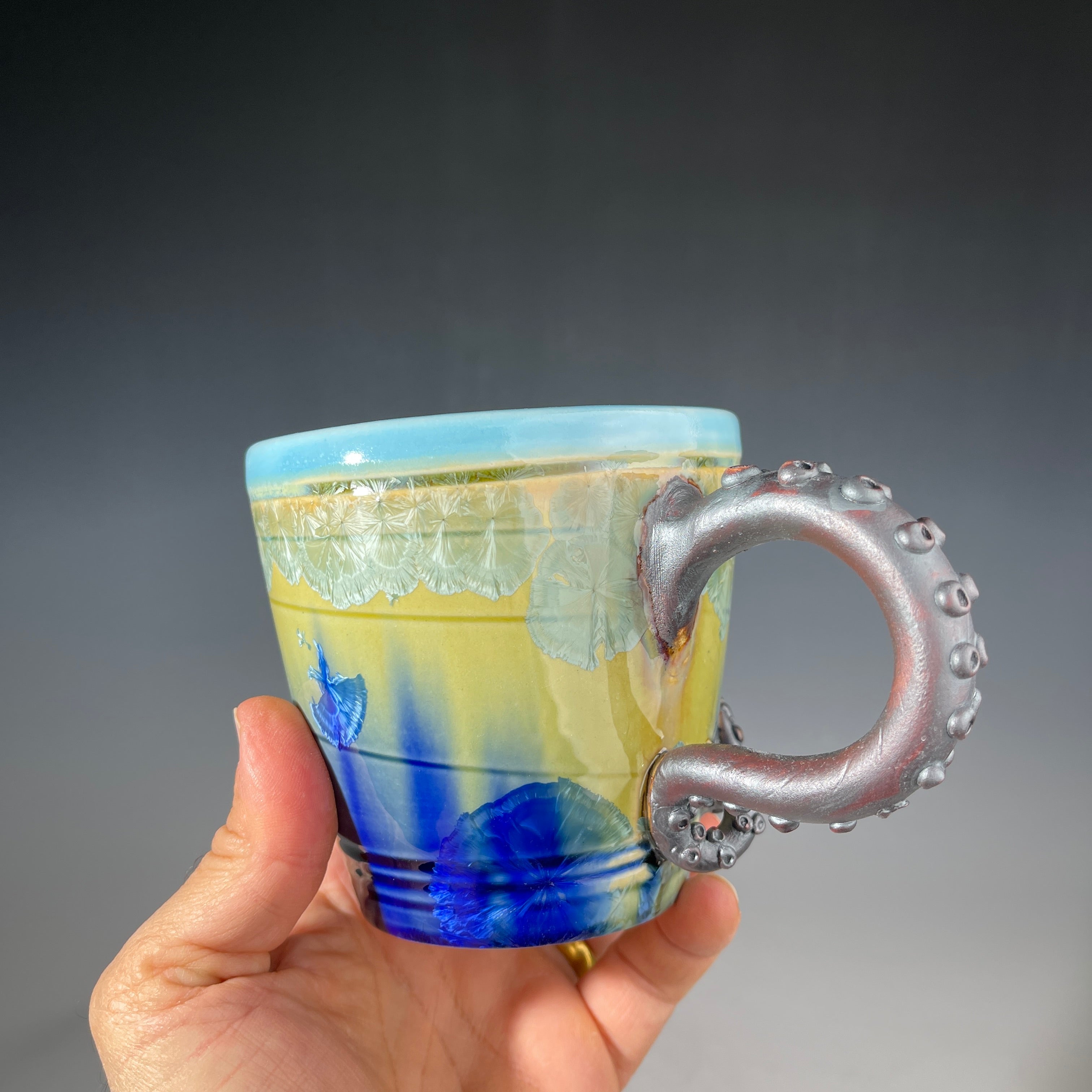 Octo-cup octopus tentacled cup with green blue sparking crystalline glaze by Adam & Hong Rubinstein 