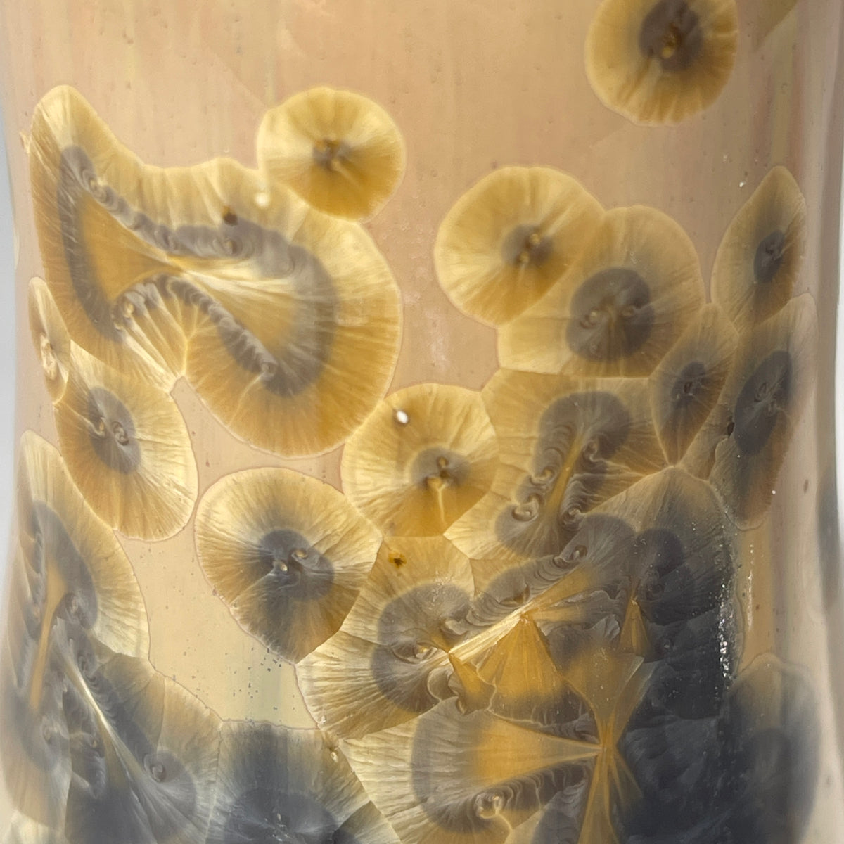 gold to charcoal soap pump is sparkling crystalline glaze close up