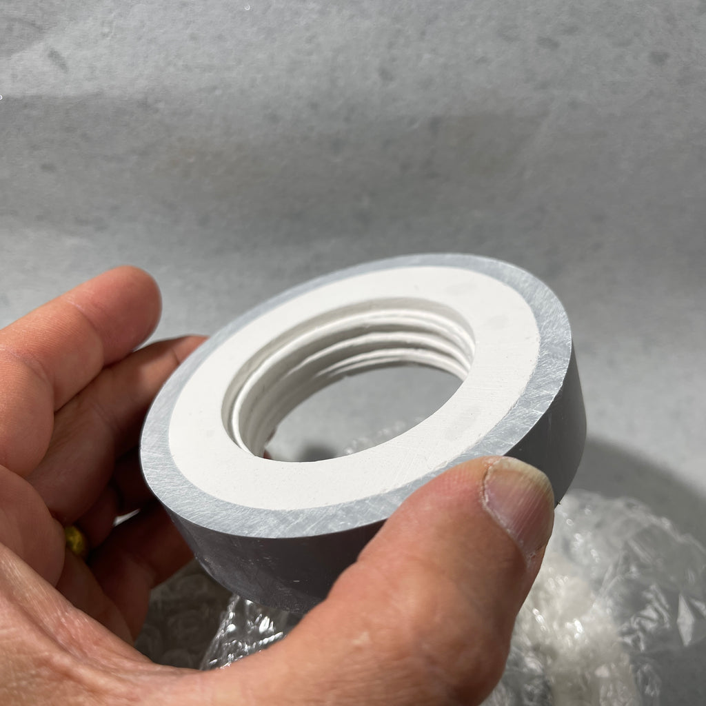 thread mold  foamer pump hand holding thread mold for making bottle threads in clay that shrinks 13%
