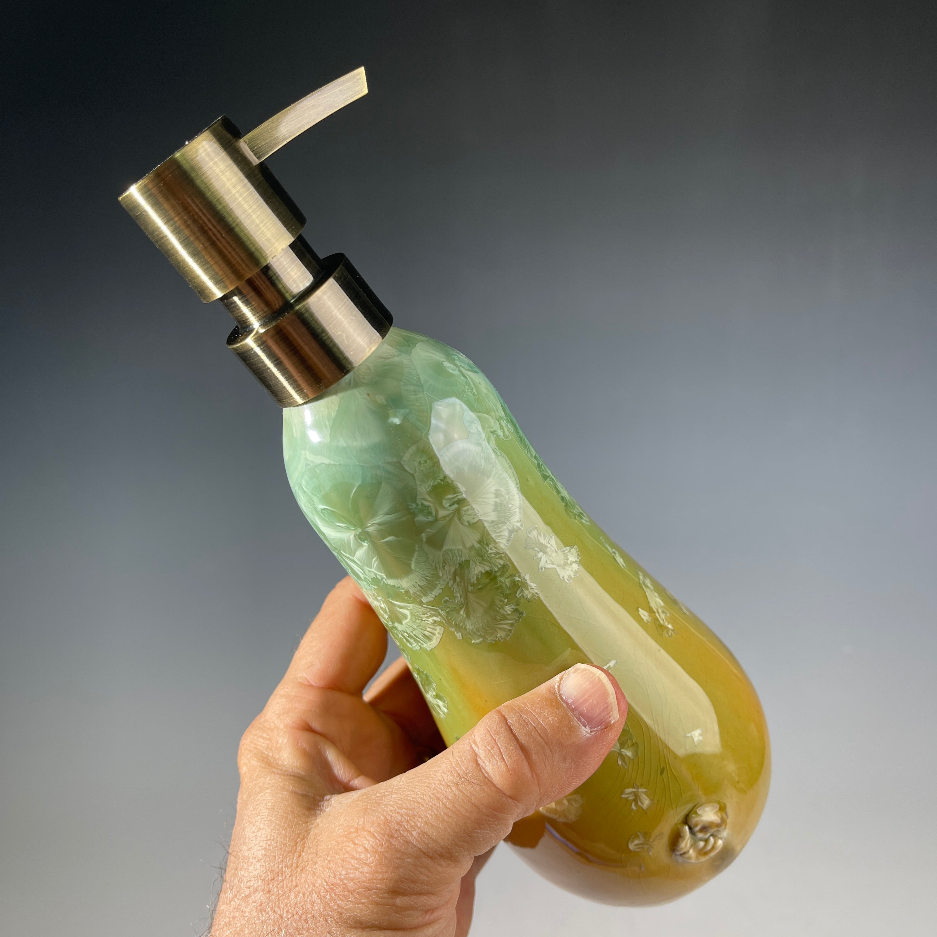 artistic soap dispenser in aqua fade to golden sunrise toned crystalline glaze