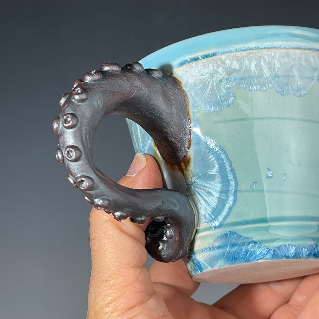 sky blue crystalline glazed cup with octopus tentacle handle by Adam & Hong Rubinstein