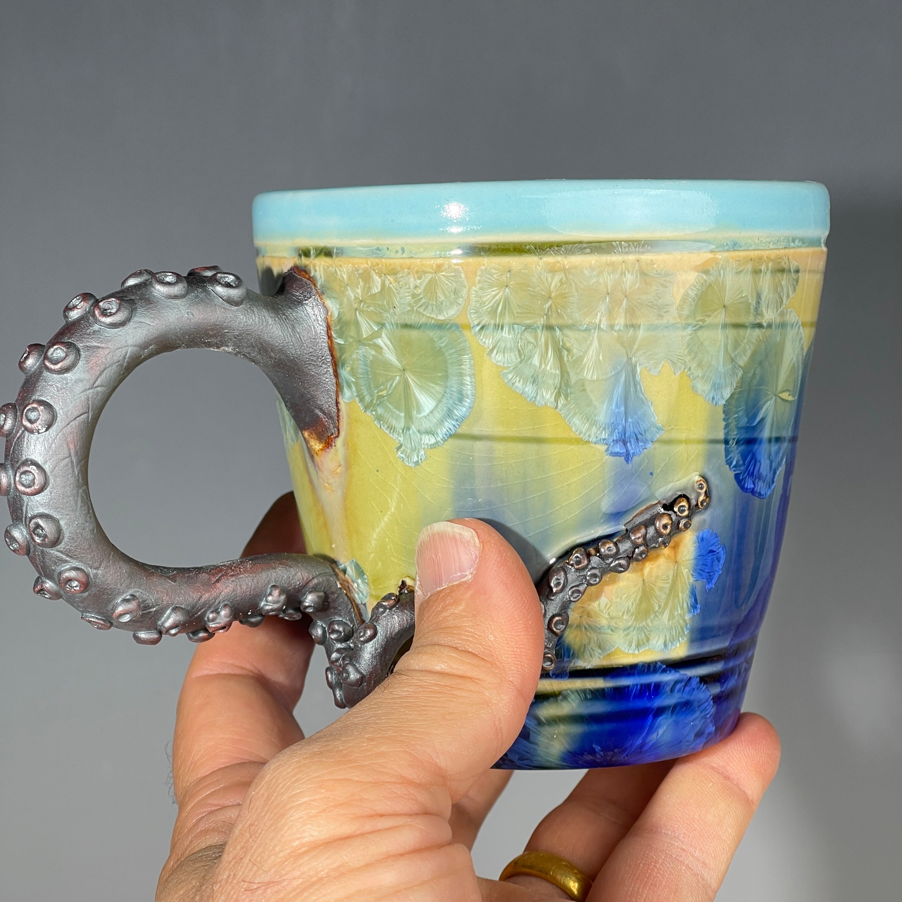 Octo-cup octopus tentacled cup with green blue sparking crystalline glaze by Adam & Hong Rubinstein 
