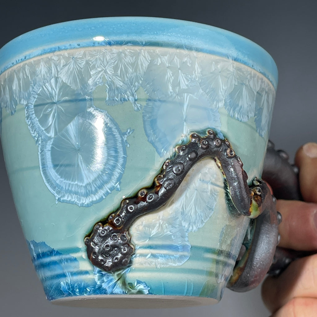 sky blue crystalline glazed cup with octopus tentacle handle by Adam & Hong Rubinstein