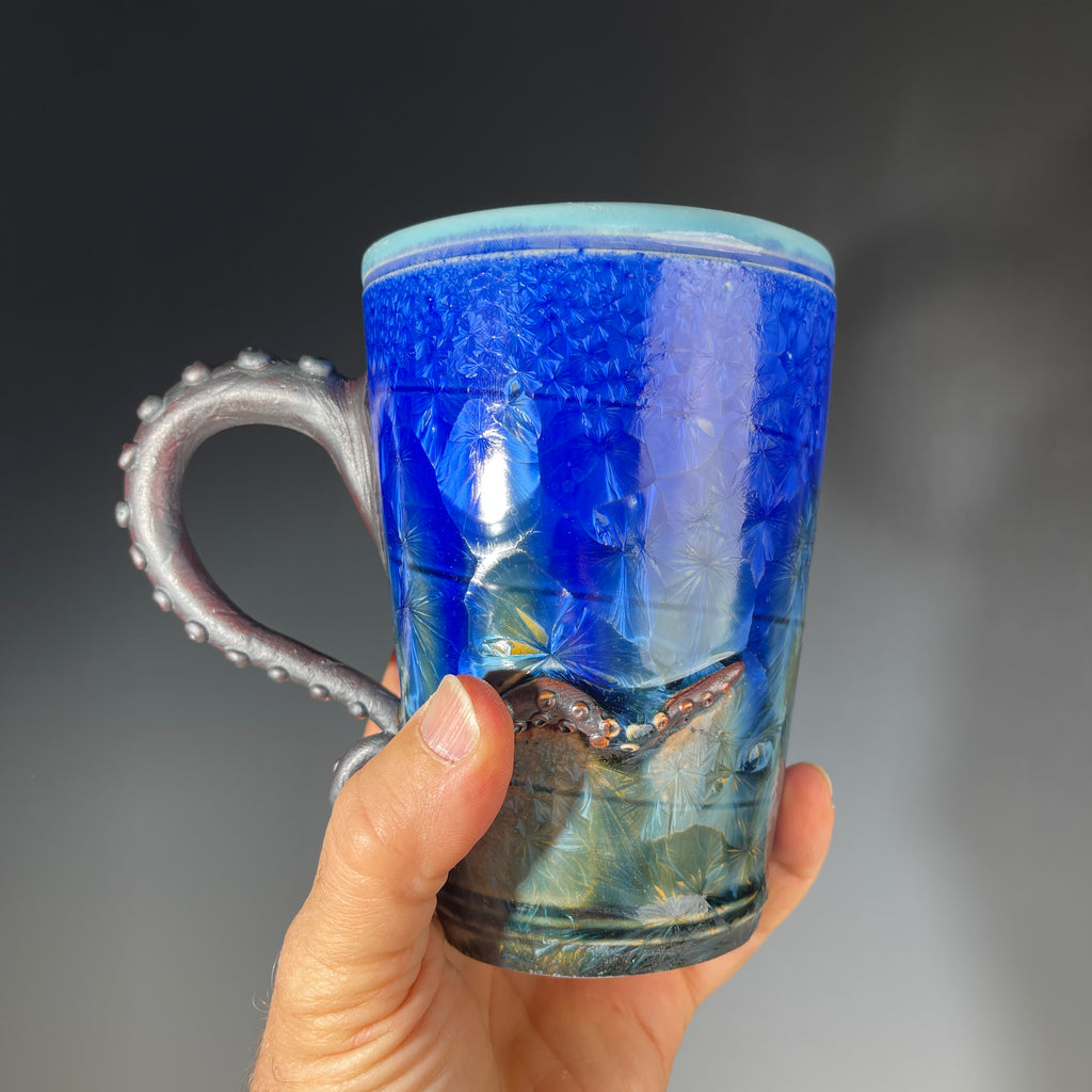 Octopus tentacled mug in deep ocean blue with sparkling crystals by Hong & Adam Rubinstein