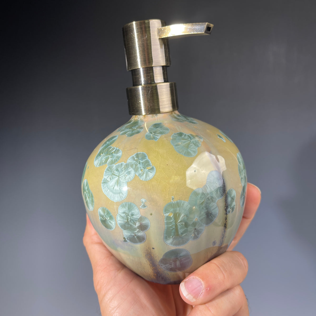 handmade soap dispenser with amazing crystalline formations in the glaze in green hues