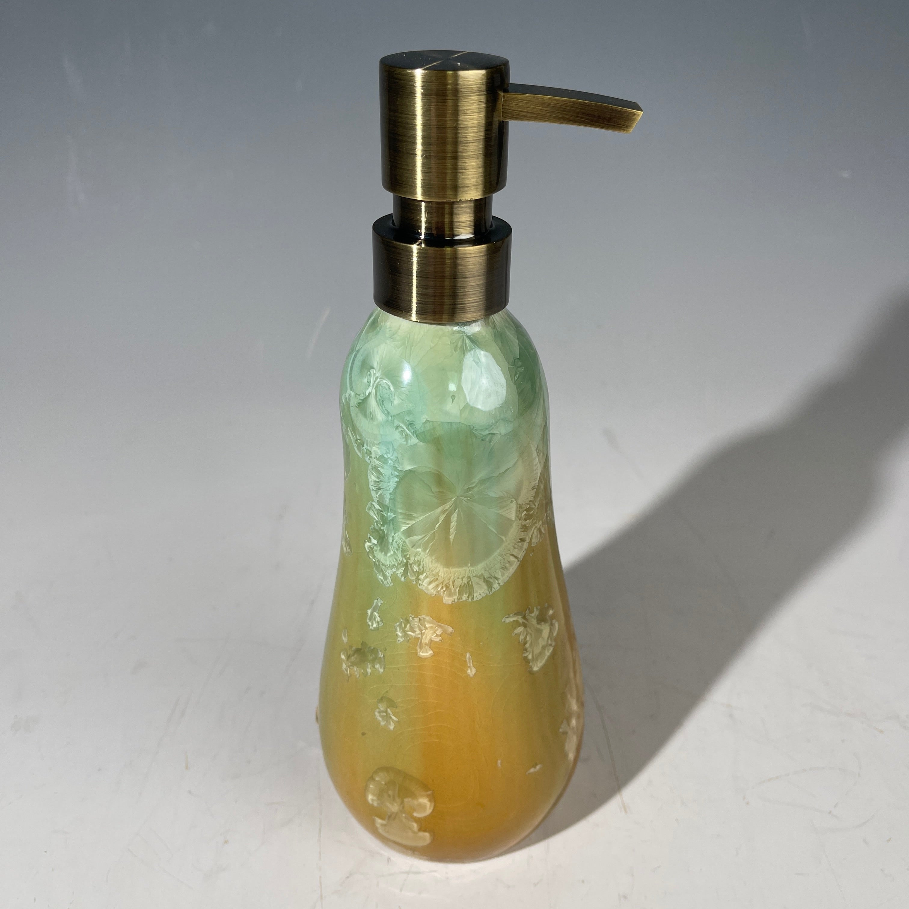 artistic soap dispenser in aqua fade to golden sunrise toned crystalline glaze