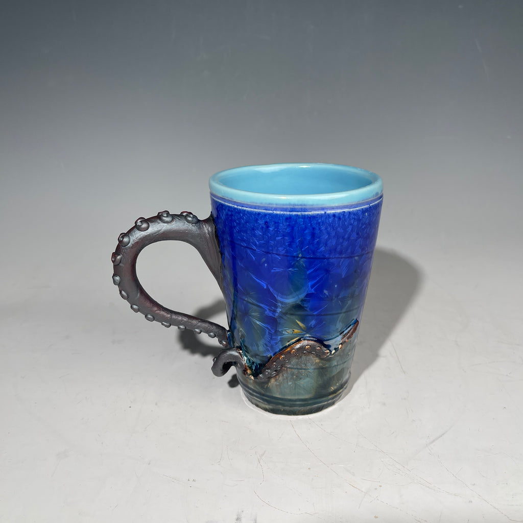 Octopus tentacled mug in deep ocean blue with sparkling crystals by Hong & Adam Rubinstein