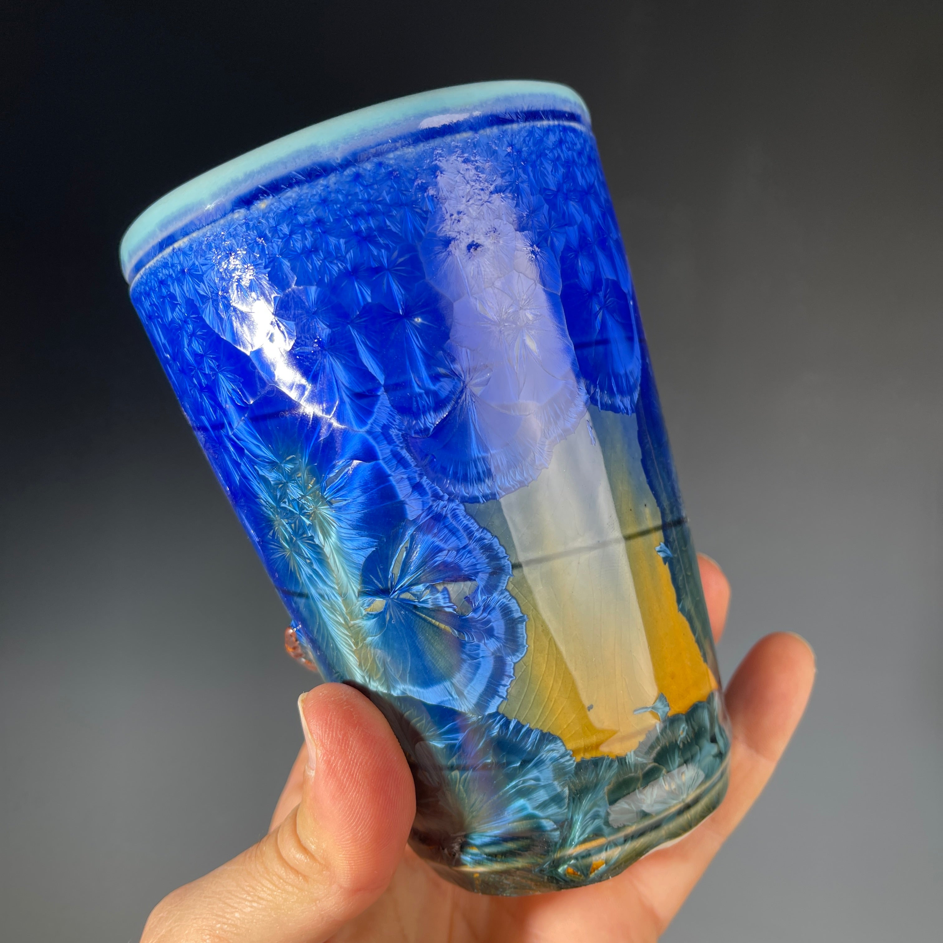 Octopus tentacled mug in deep ocean blue with sparkling crystals by Hong & Adam Rubinstein