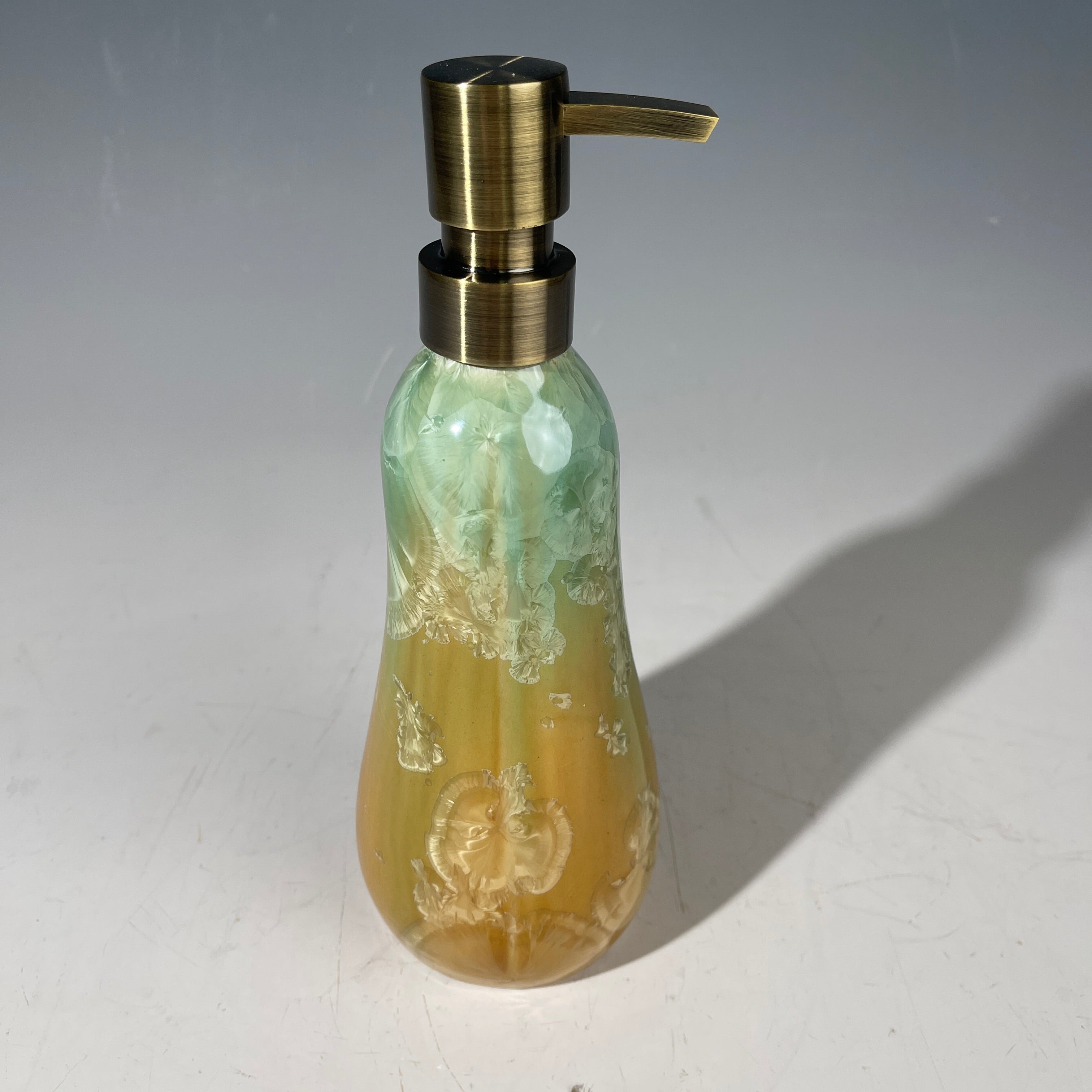 artistic soap dispenser in aqua fade to golden sunrise toned crystalline glaze