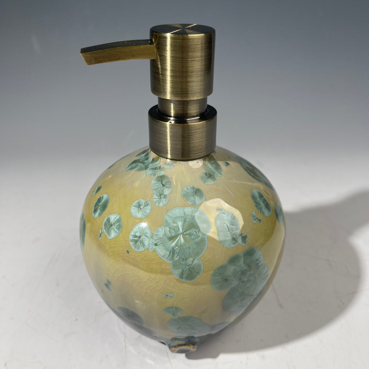 handmade soap dispenser with amazing crystalline formations in the glaze in green hues