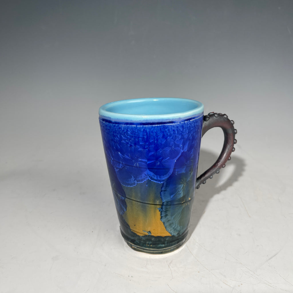 Octopus tentacle mug in cobalt macro crystalline glaze by Adam & Hong Rubinstein 