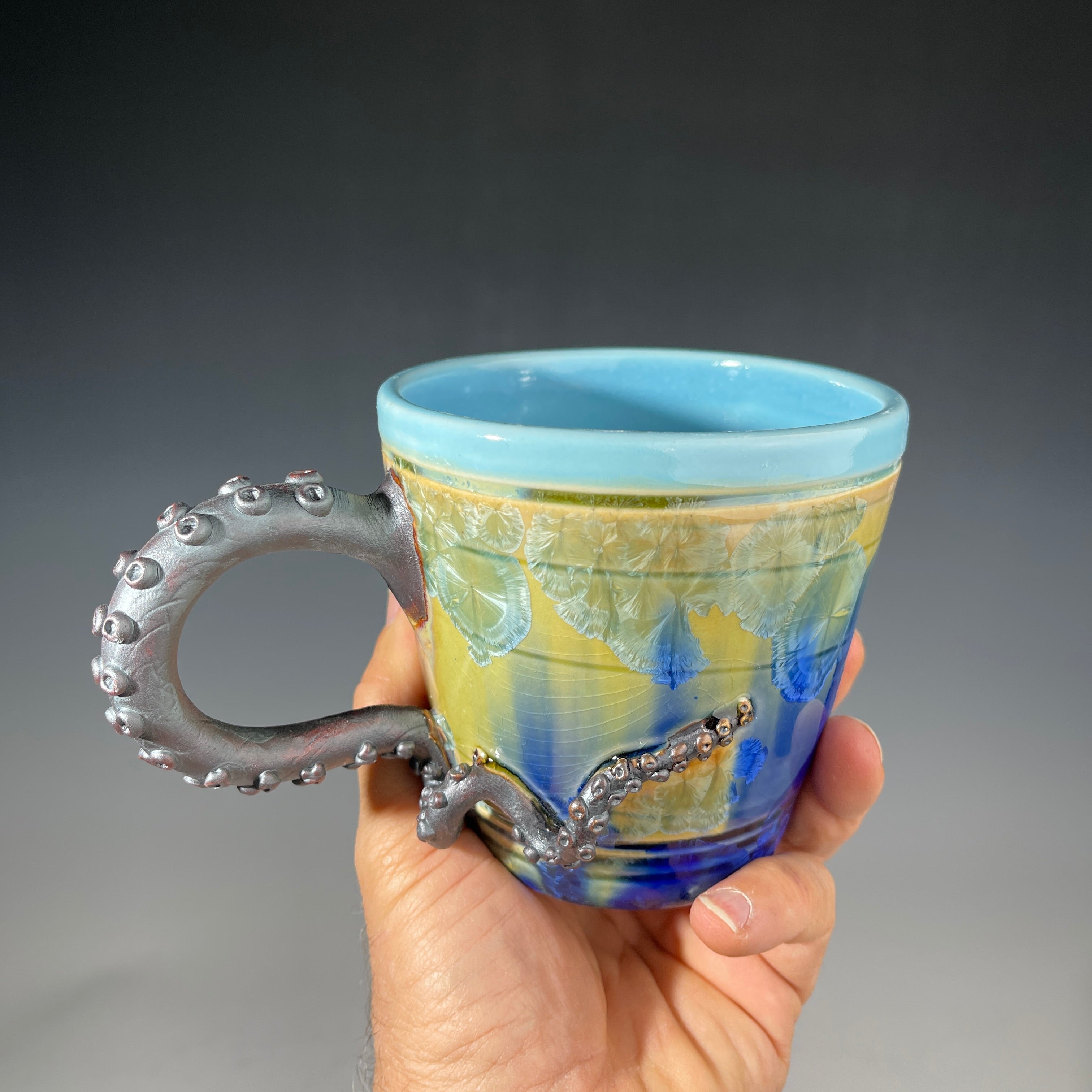 Octo-cup octopus tentacled cup with green blue sparking crystalline glaze by Adam & Hong Rubinstein 