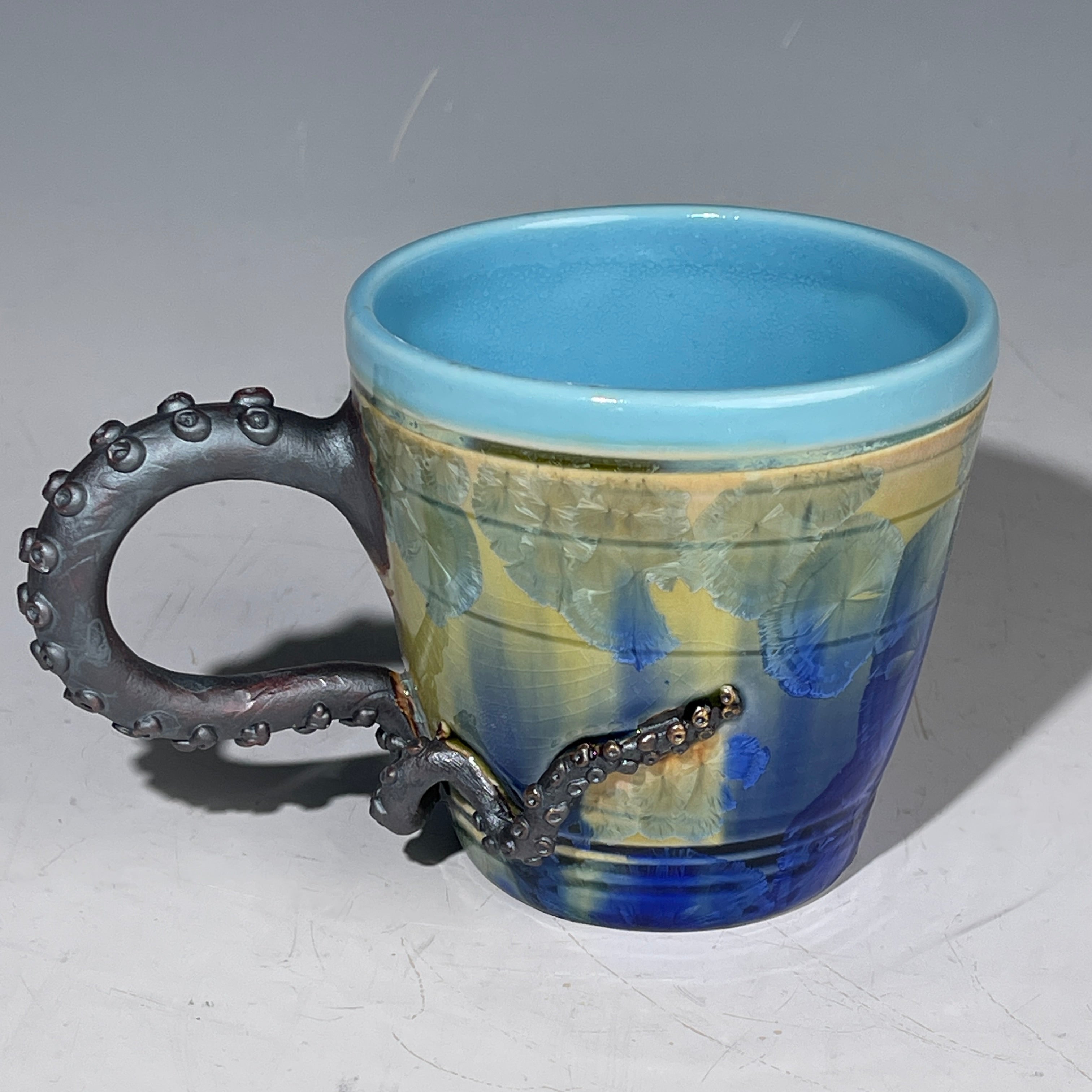 Octo-cup octopus tentacled cup with green blue sparking crystalline glaze by Adam & Hong Rubinstein 