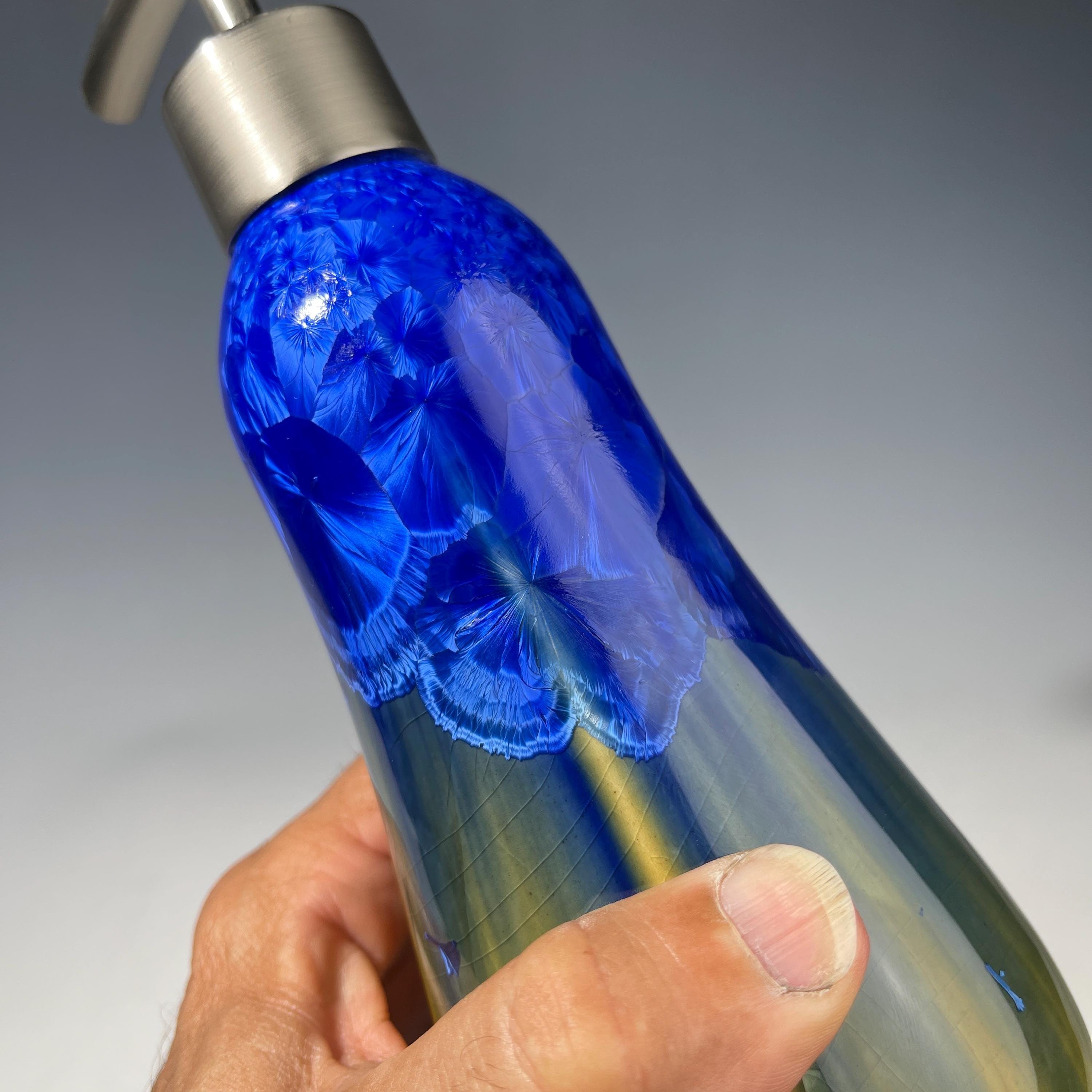 A refractive orange dreams of blue soap pump soap or lotion dispenser