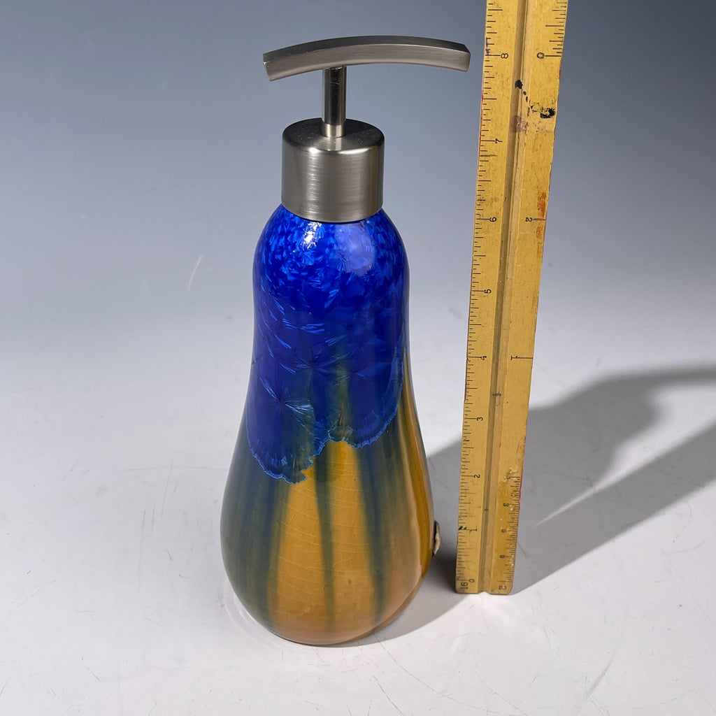 A refractive orange dreams of blue soap pump soap or lotion dispenser