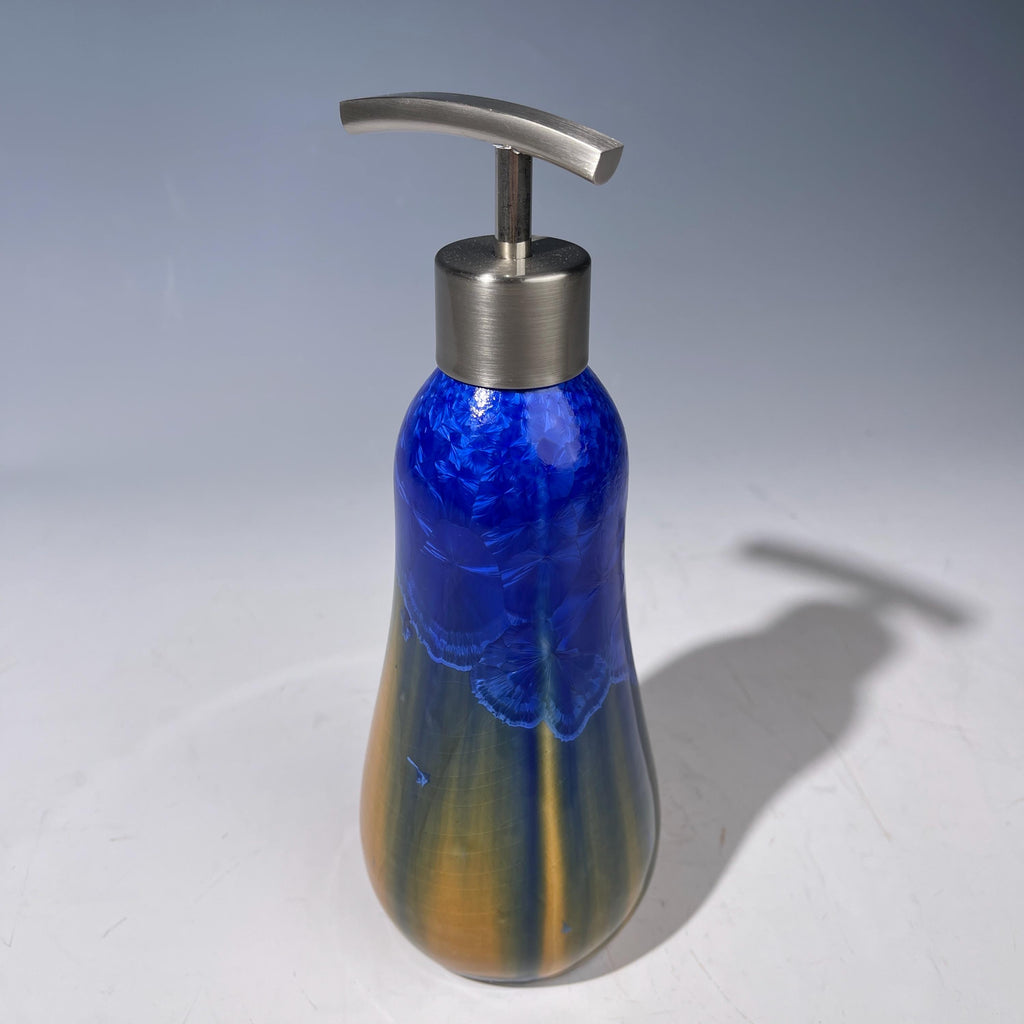 A refractive orange dreams of blue soap pump soap or lotion dispenser