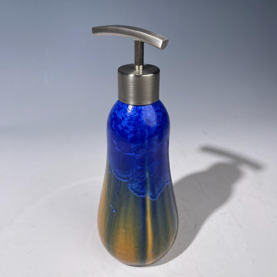A refractive orange dreams of blue soap pump soap or lotion dispenser