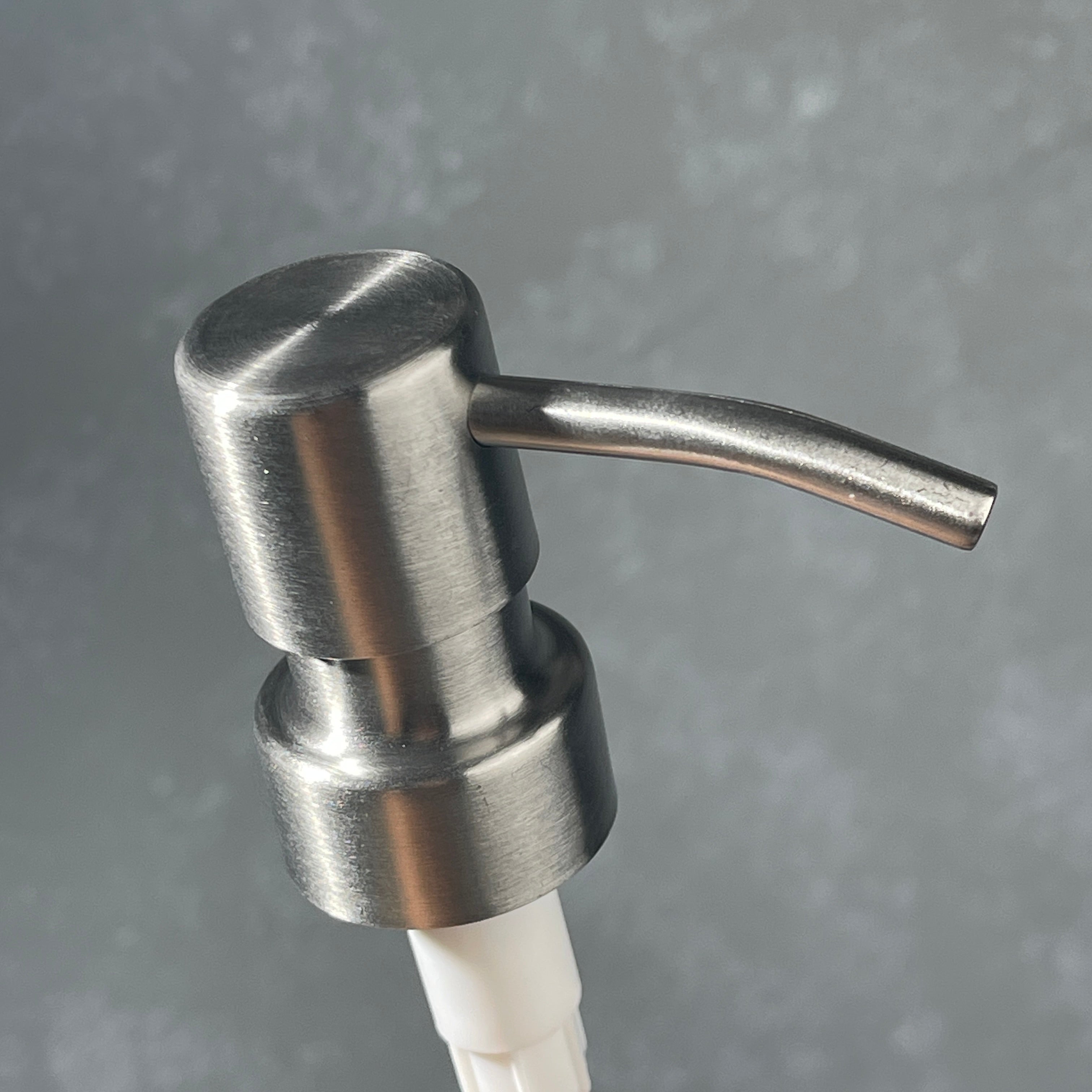 Stainless steel  ez pleaser soap dispenser on a gradiant background