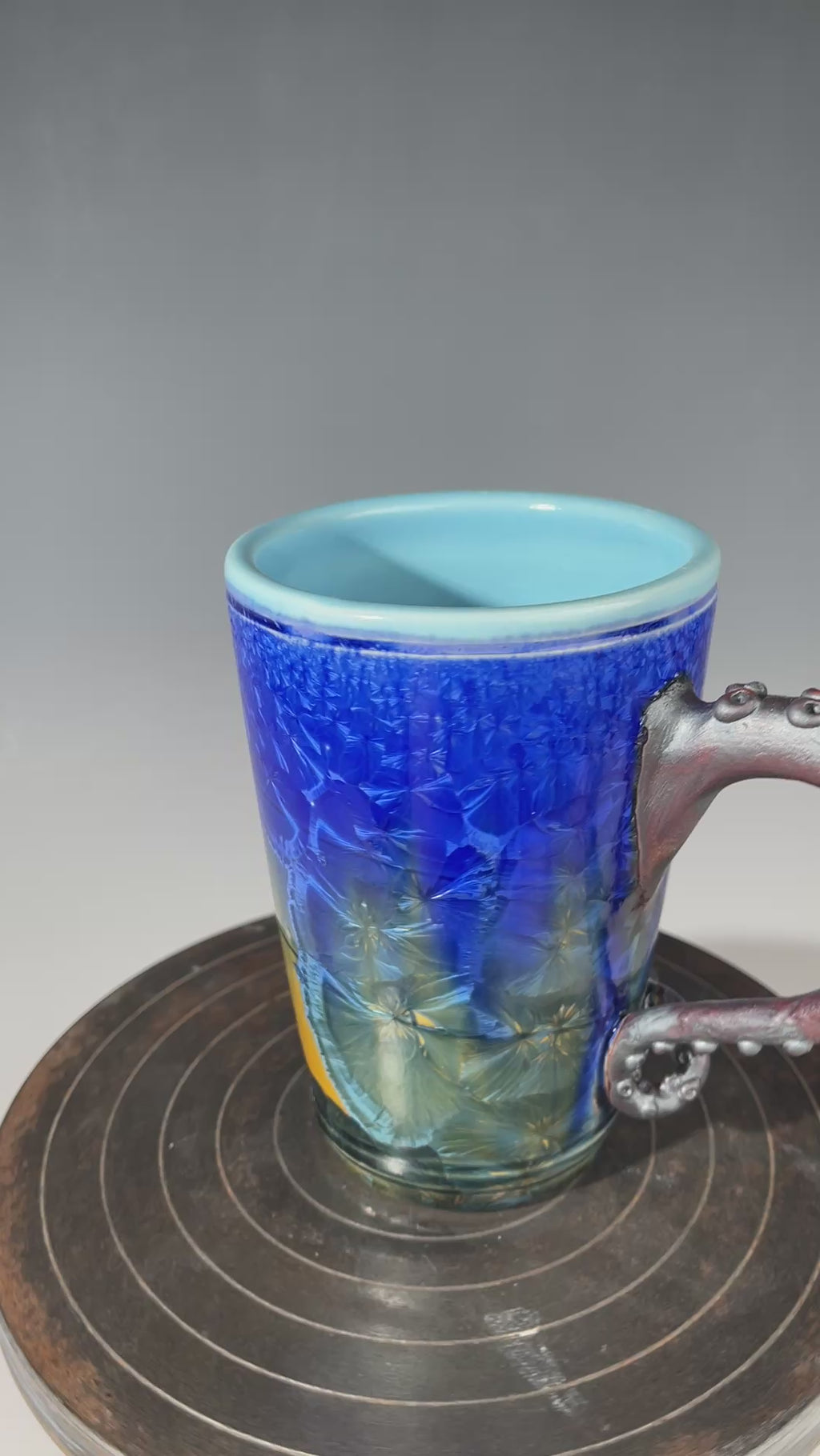 Octopus tentacled mug in deep ocean blue with sparkling crystals by Hong & Adam Rubinstein