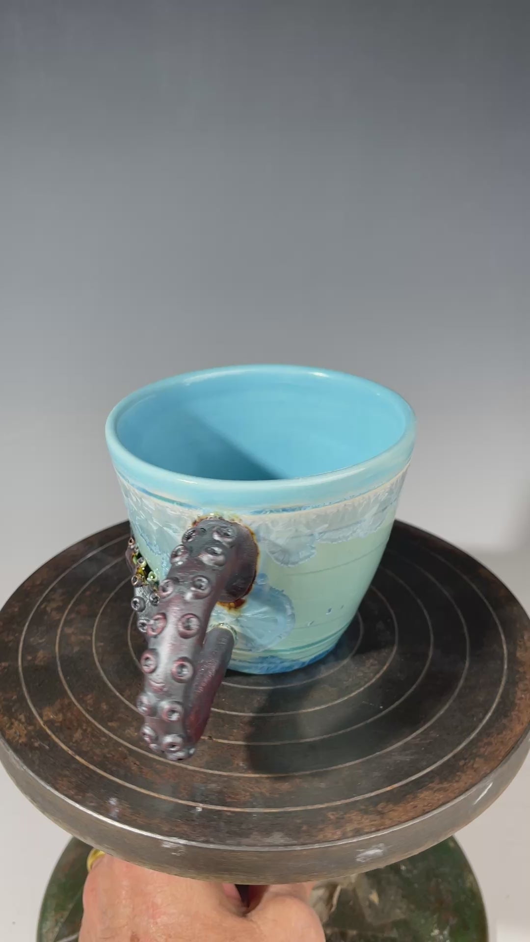 sky blue crystalline glazed cup with octopus tentacle handle by Adam & Hong Rubinstein