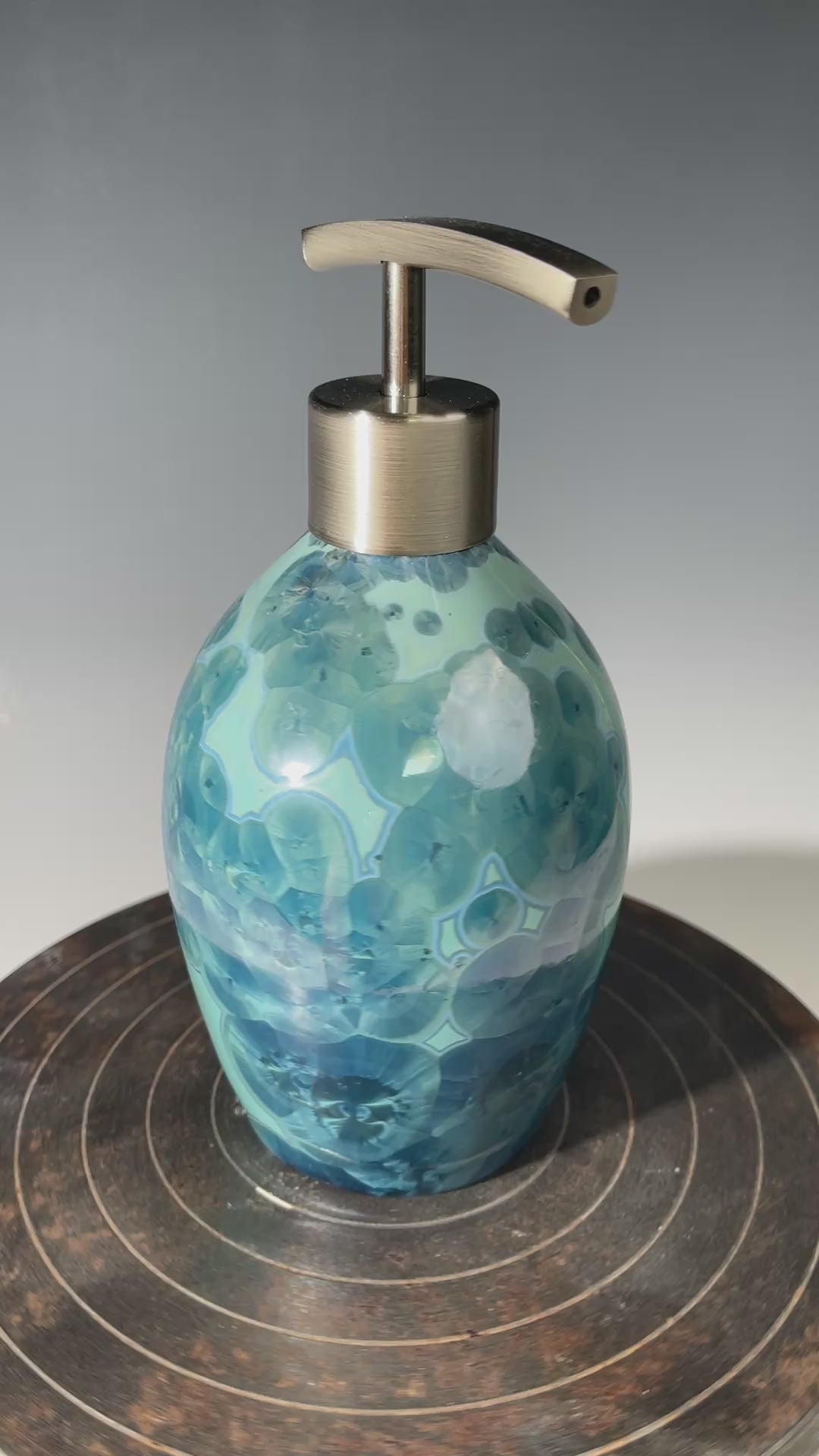 Video of a unique art soap dispenser by Hong Rubinstein in an ocean hued sparkling refractive  macro crystalline glaze
