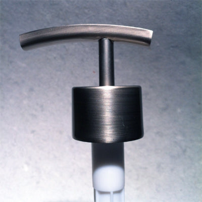 Metallic pump dispenser on a gray background